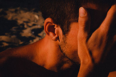 Close-up of man hand covering face