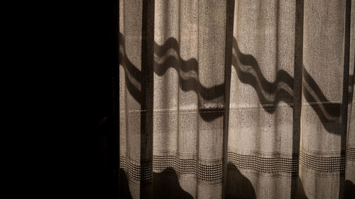 Close-up of shadow on curtain 