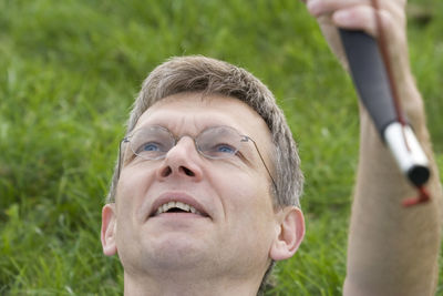 Close-up of thoughtful man looking up