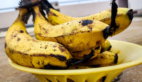 Close-up of yellow fruit on table