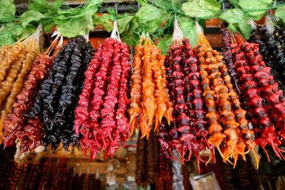 Close-up of fruits hanging in market stall
