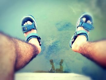 Low section of people on sea shore