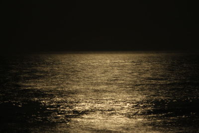 Scenic view of sea against sky at night