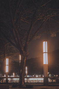 Illuminated building against sky at night