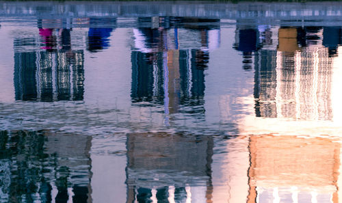 Reflection of people in puddle