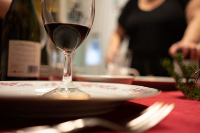 Close-up of wine in glass on table