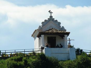 Built structure against cloudy sky