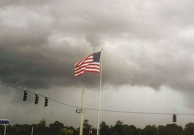 Low angle view of flag against sky