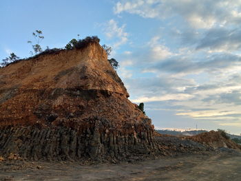 Rock formation on land against sky