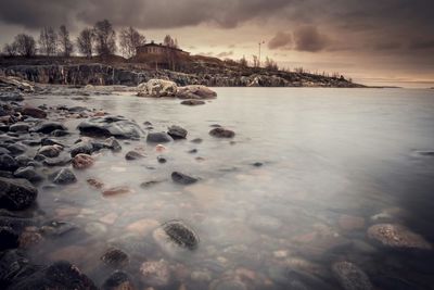 Scenic view of sea against cloudy sky