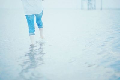 Reflection of woman in water