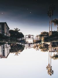 Reflection of buildings in city at night