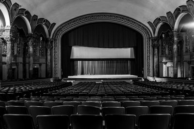 Empty seats in building theater bnw