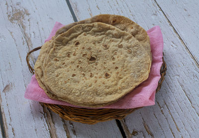 High angle view of bread in basket on table