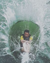 Portrait of young man in sea