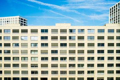 Low angle view of buildings against blue sky