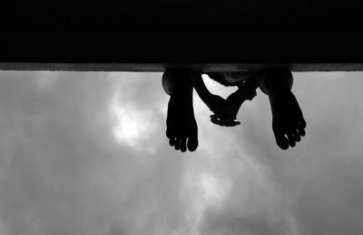 Low angle view of people against sky