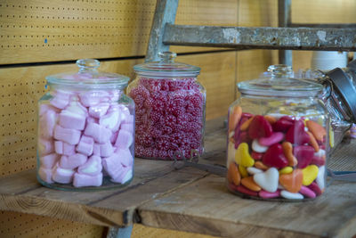 Close-up of candies in glass jar on table