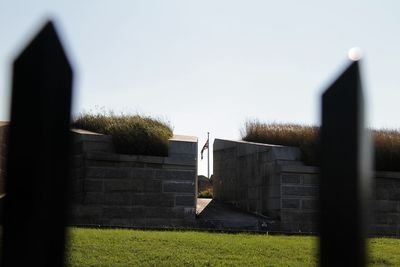 Built structure on field against clear sky