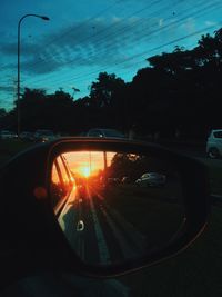 Car on road at sunset