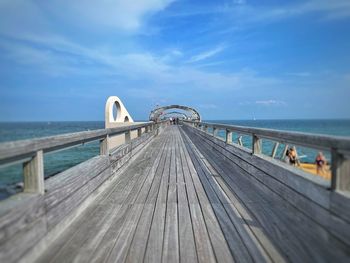 Pier over sea against sky