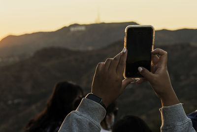 Taking photos of hollywood sign at sunset