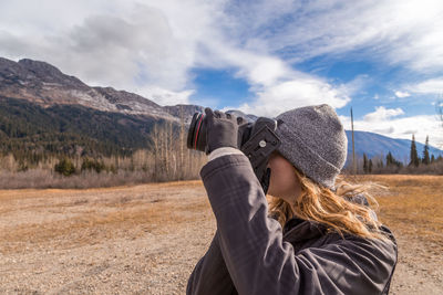 Woman wearing hat against sky