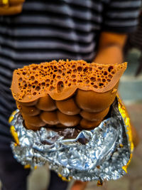 Close-up of man holding ice cream