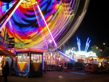 Illuminated ferris wheel at night