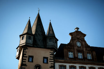 Low angle view of building against clear blue sky