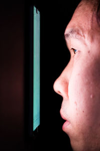 Close-up portrait of woman looking away