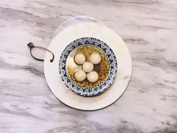 High angle view of eggs in plate on table