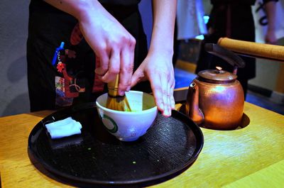 Midsection of woman preparing food