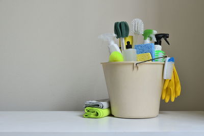 Close-up of toy in container against wall