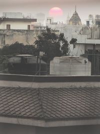High angle view of water storage tanks in building terrace