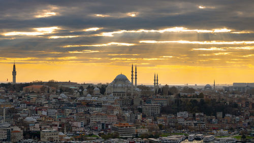 Cityscape against sky during sunset