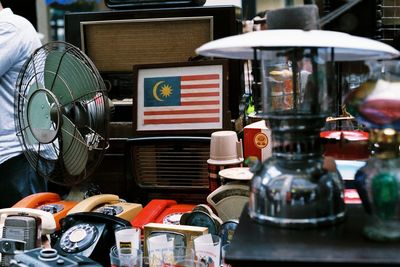 Close-up of old objects for sale on table in store