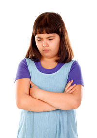 Close-up of teenage girl against white background