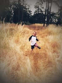 Rear view of man on field