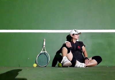 Full length of woman playing tennis
