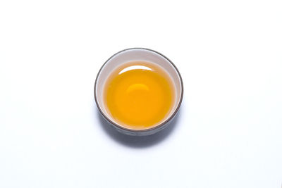 High angle view of tea cup against white background