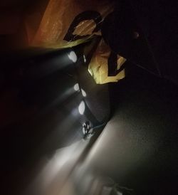 High angle view of man in dark room