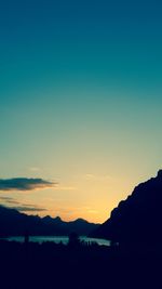 Silhouette of mountain against sky at sunset