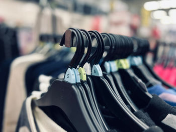 Close-up of clothes hanging on rack