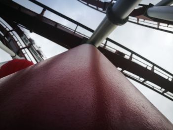 Close-up of woman hand on escalator