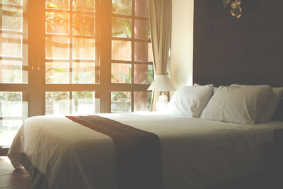 Sunlight falling on bed at home