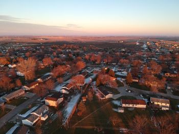 High angle view of buildings against sky at sunset iowa snow