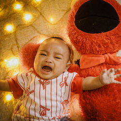 Portrait of cute baby girl lying down