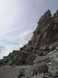 Low angle view of rock formations against sky