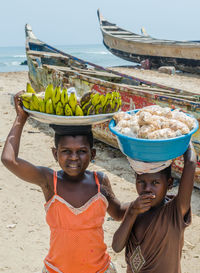 Portrait of boy standing on beach